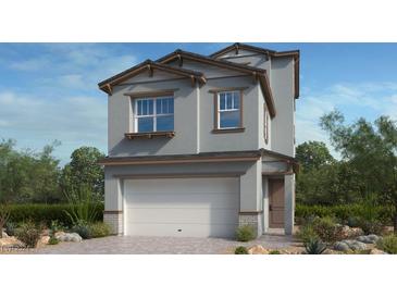 Charming two-story home with a gray exterior, white garage door, and landscaped yard at 633 N Water St, Henderson, NV 89015