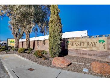 Sunset Bay community entrance with landscaping at 6875 Tamarus St # 103, Las Vegas, NV 89119