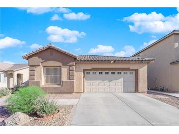 One-story house with attached garage, landscaping, and neutral color scheme at 3706 Tundra Swan St, Las Vegas, NV 89122