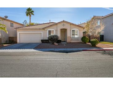 Single-story house with a two-car garage and landscaped front yard at 2379 Brockton Way, Henderson, NV 89074