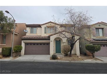 Two-story house with brown garage door and green front door at 8036 Sundance Valley Dr, Las Vegas, NV 89178