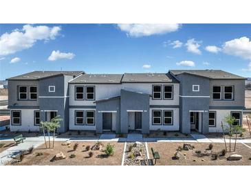 Contemporary triplex with landscaped grounds and two-car garages at 5012 Apple Mesa Ave # Lot 67, Las Vegas, NV 89139