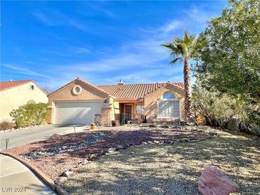 Single-story home with desert landscaping and a two-car garage at 540 Viva Serenade Way, Henderson, NV 89015