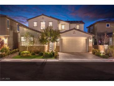 Two-story house with a neutral color scheme and landscaping at 16 Cresta Villa Ct, Henderson, NV 89011