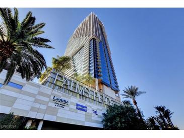 Luxury high-rise building with palm trees and resort amenities at 4381 W Flamingo Rd # 9301, Las Vegas, NV 89103