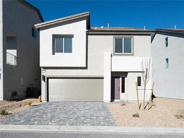 Two-story home with gray exterior, paver driveway, and landscaping at 5904 Becklow Gardens Ave, Las Vegas, NV 89141