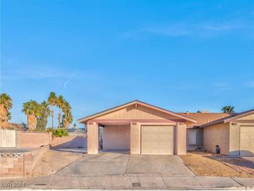 Cute stucco house with a two-car garage and desert landscaping at 3970 Calle Paula, Las Vegas, NV 89103