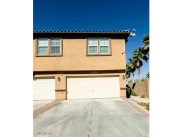 Two-car garage with ample space and a spacious driveway at 6255 W Arby Ave # 356, Las Vegas, NV 89118