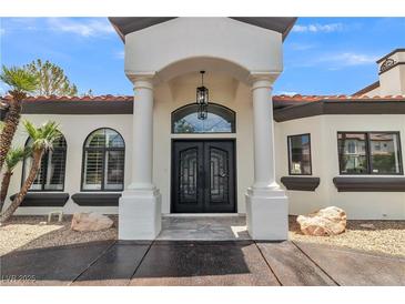 Stunning two-story home with a grand entrance and meticulous landscaping at 1870 Jasmine Joy Ct, Las Vegas, NV 89117