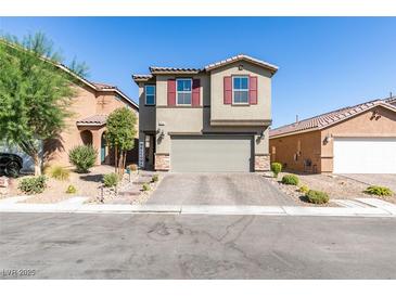 Two-story house with gray siding, red shutters, and a paved driveway at 6530 Secret Grove Ave, Las Vegas, NV 89130