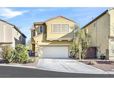 Two-story house with a two-car garage and landscaping at 6288 Sledgehammer Ct, North Las Vegas, NV 89081