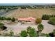 Aerial view showing house, driveway, and surrounding desert landscape at 2200 N Moapa Valley Blvd, Logandale, NV 89021