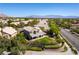 Aerial view of house, backyard, and neighborhood; showcasing landscaping and mountain views at 10301 Horseback Ridge Ave, Las Vegas, NV 89144