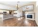 Kitchen features island, hardwood floors and fireplace at 10301 Horseback Ridge Ave, Las Vegas, NV 89144