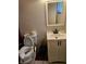 Bathroom with a toilet, vanity, and mirror at 1920 Walnut Ave, Las Vegas, NV 89101