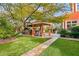 Covered patio with outdoor kitchen and seating at 2200 Purple Majesty Ct, Las Vegas, NV 89117