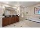 Luxurious bathroom with double sinks, large mirror, and a walk-in shower at 125 E Harmon Ave # 2318, Las Vegas, NV 89109