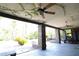 Covered patio with brick columns, ceiling fan, and access to the backyard at 7650 Via Olivero Ave, Las Vegas, NV 89117