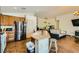 Kitchen with island, stainless steel appliances, and wooden cabinets at 5717 Wizard Wand St, North Las Vegas, NV 89031