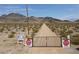 Long private gated driveway leading to a custom home on acreage at 4751 W Adkisson St, Pahrump, NV 89060