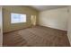 Living room with vaulted ceiling, carpet, and window at 8009 Draco Cir # 201, Las Vegas, NV 89128