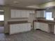 Modern kitchen with white cabinets and granite countertops at 664 Sky Rd, Indian Springs, NV 89018