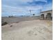 Large backyard with block wall and covered patio at 6733 E Carey Ave, Las Vegas, NV 89156