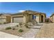 Front view of house with walkway and landscaping at 6607 Summershade St, North Las Vegas, NV 89086