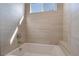 Clean bathroom with a bathtub and large window at 6235 Fire Lake Ct, Las Vegas, NV 89149