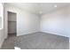 Simple bedroom with grey carpet and a walk-in closet at 6235 Fire Lake Ct, Las Vegas, NV 89149