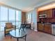 Living room with city view, kitchenette, and seating at 135 E Harmon Ave # 2104, Las Vegas, NV 89109