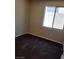 Well lit bedroom with dark carpet and neutral walls at 2748 Brinkley Manor St, Laughlin, NV 89029