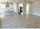 Open living space with wood-look tile floors and lots of natural light at 4841 E Graystone Dr, Pahrump, NV 89061