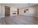 Spacious living room with modern fireplace and wood-look flooring at 6255 Fire Lake Ct, Las Vegas, NV 89149