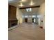 High-ceilinged living room with brick fireplace and hardwood floors at 7664 Angel Crest Cir, Las Vegas, NV 89117