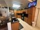 Spacious kitchen with ample cabinetry, granite countertops, and black appliances at 1458 Palm Dr, Laughlin, NV 89029