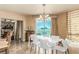 Elegant dining area with a white table and a chandelier, overlooking the city at 2877 Paradise Rd # 702, Las Vegas, NV 89109