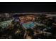 Aerial night view of resort complex with pools and landscaping at 145 E Harmon Ave # 2208, Las Vegas, NV 89109