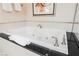 Close-up view of a large, luxurious soaking tub at 145 E Harmon Ave # 2208, Las Vegas, NV 89109