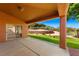 Covered patio with sliding glass doors and access to the backyard at 437 Via Ventana Dr, Mesquite, NV 89027