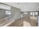 Open living area with wood floors, recessed lighting, and view of the kitchen at 909 Rhyolite Ter, Henderson, NV 89011