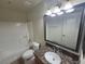 Bathroom featuring granite vanity, tub, and updated fixtures at 7730 Secret Shore Dr # 207, Las Vegas, NV 89128