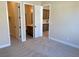 Spacious bedroom with access to bathroom and walk-in closet at 9166 Chandler Bloom Ct, Las Vegas, NV 89139