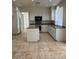 Kitchen with white cabinets, island, and tile floor at 1003 Dover Glen Dr, North Las Vegas, NV 89031