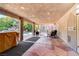 Covered patio with flagstone flooring and pool view at 8275 W Craig Rd, Las Vegas, NV 89129