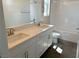 Bathroom with double vanity, white cabinets and tile at 9190 Chandler Bloom Ct, Las Vegas, NV 89139