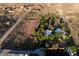 Aerial view of land with a house and red rock mountains in the background at 14525 Heyer Way, Las Vegas, NV 89161