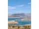 Stunning lake view with mountains and clear blue water at 7192 Polita Ct, Las Vegas, NV 89156