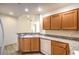 Kitchen with light wood cabinets, granite countertops, and white appliances at 43 E Agate Ave # 204, Las Vegas, NV 89123