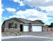 Two-story home with two-car garage and landscaping at 10096 Goff Grove Ct, Las Vegas, NV 89183